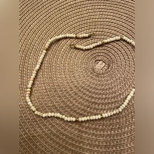 White turquoise bead necklace with gold filled open rings.